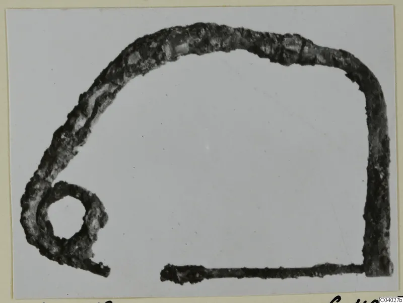 Corroded bronze object with a loop, from the Kastros tombs at Lapithos