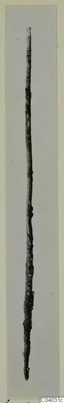 Long slender bronze tool, corroded and pointed at one end, from Idalion