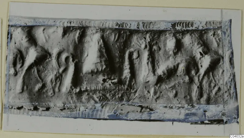 Impression of a rectangular seal with worn figures in low relief, mounted on a card