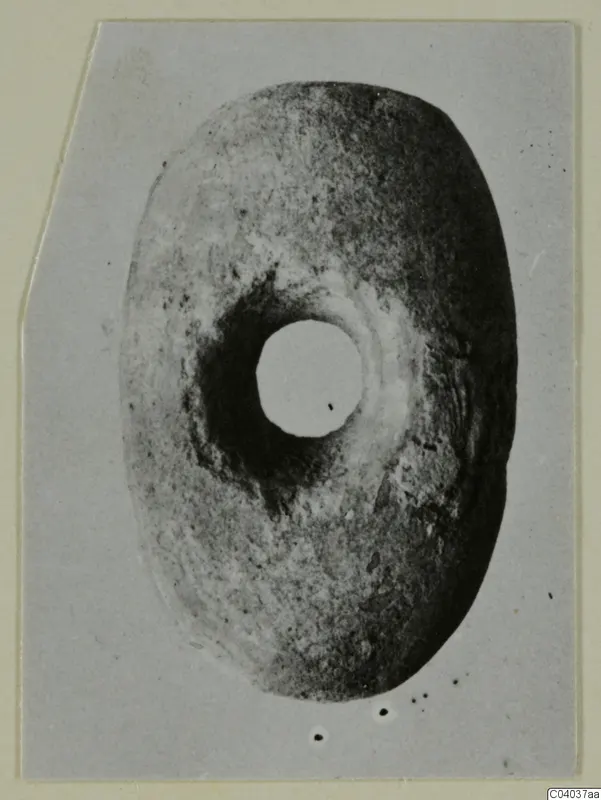 Disc-shaped object with a large central hole, small find from Idalion