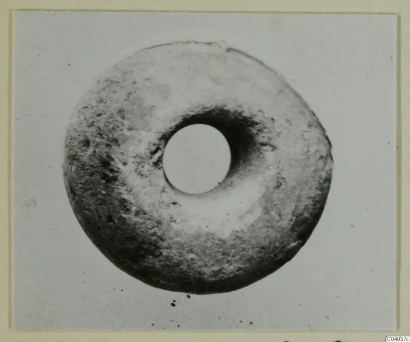 Ring-shaped small find from Idalion with a large central hole, photographed face-on
