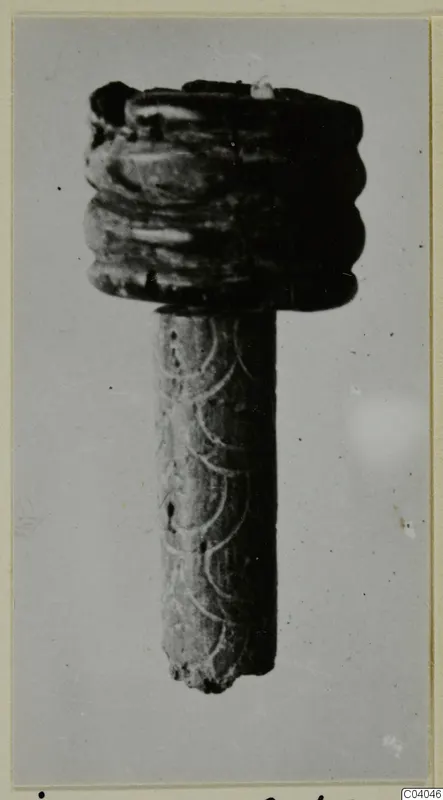 Bone object with a ridged top and an incised arc pattern on its shaft, from Idalion