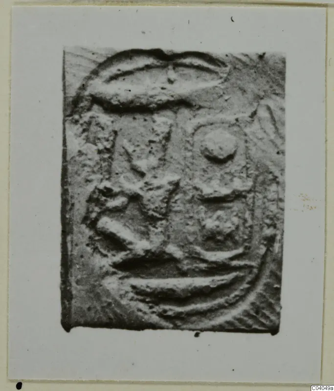 Rectangular seal with raised curved, angular and round motifs