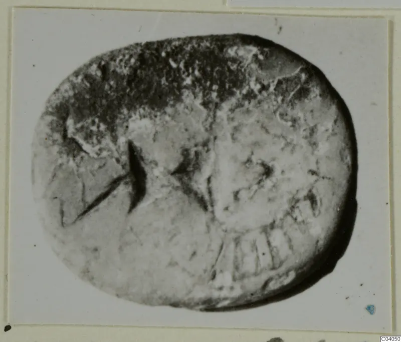 Glyptic: oval stone seal from Idalion with a worn engraved design
