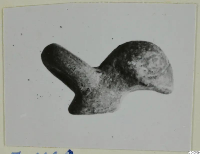 Fragment of a bronze mounting from Idalion, a rounded metal piece with one narrow arm, shown on a card mount