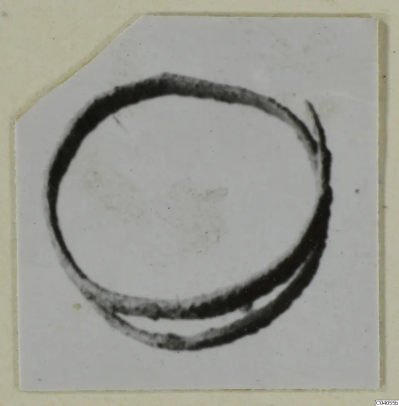 Bronze personal adornment: a thick loop of metal with one end overlapping the other, shown on a card mount.