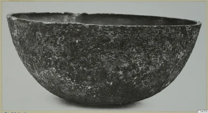 Deep, rounded bowl with a rough, encrusted surface, from the Kastros tombs at Lapithos, seen from the side