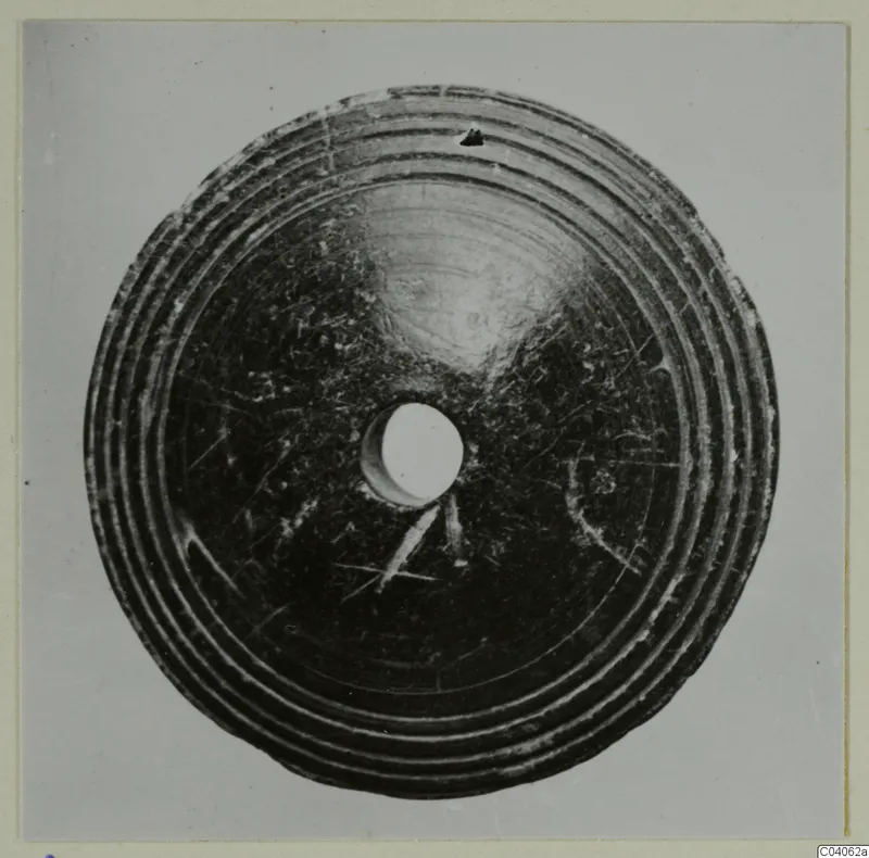 Disc-shaped small find with concentric ridges and a central hole, from Idalion