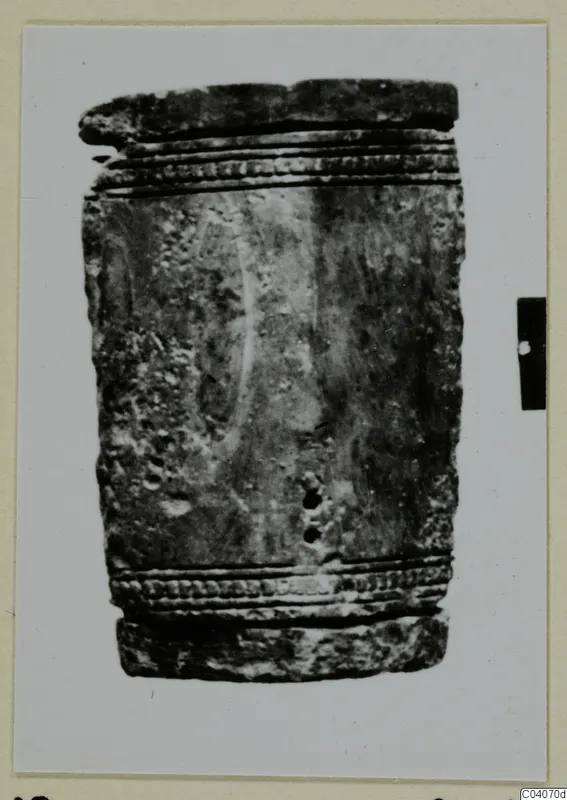 Cylindrical object from Enkomi with ridged, dotted bands at top and bottom and a row of small holes