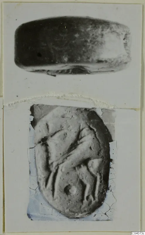 Two photographs of an oval engraved seal on a card mount: a side view above and its carved face below.