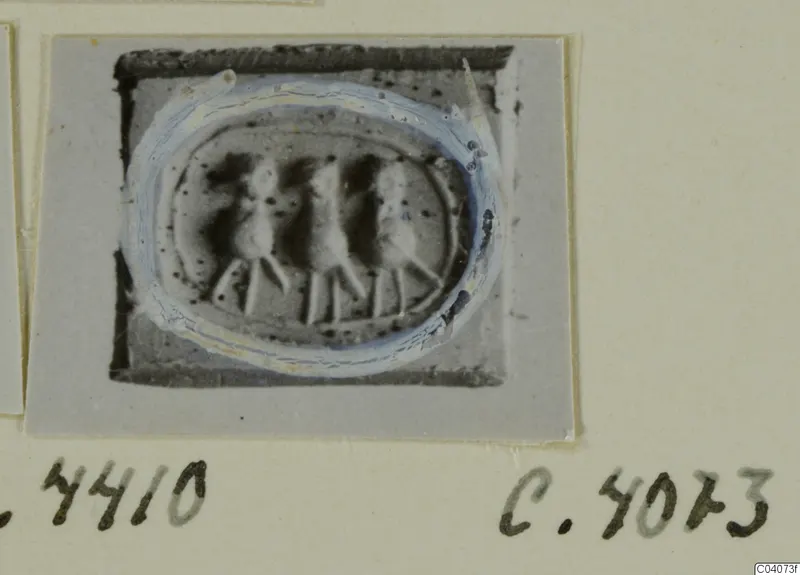 Oval engraved stone from Ayia Irini, with three upright figures standing in a row across its centre