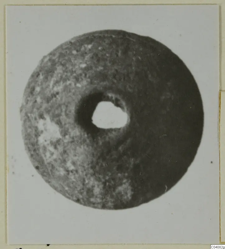 Disc-shaped find with a round central hole, from Ayia Irini