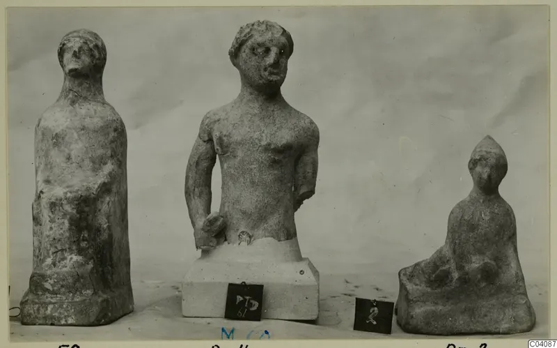 Three figures and sculptures from Marion, photographed on a plain pale backdrop