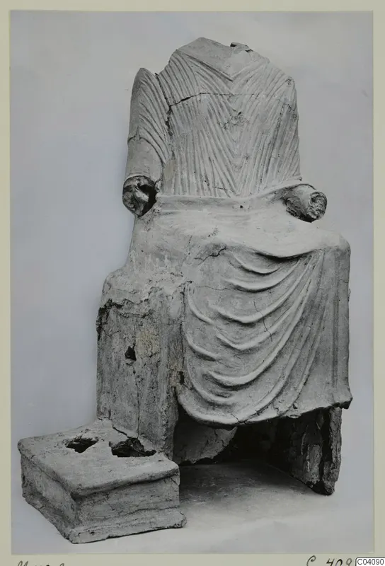 Seated headless figure with a draped garment and incised upper body, a find from Marion