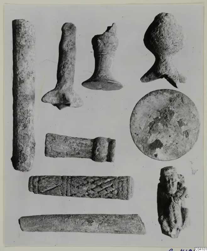 Group of worked stone objects from Arsos, including a cylinder with a diagonal incised pattern