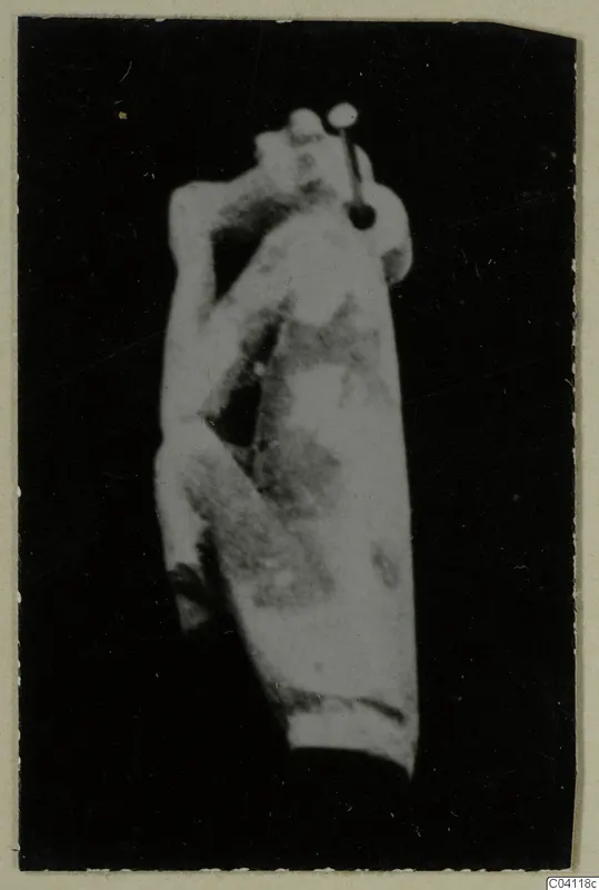 Blurred photograph of a figure-shaped object, possibly a sculpture fragment, from Amathus tombs