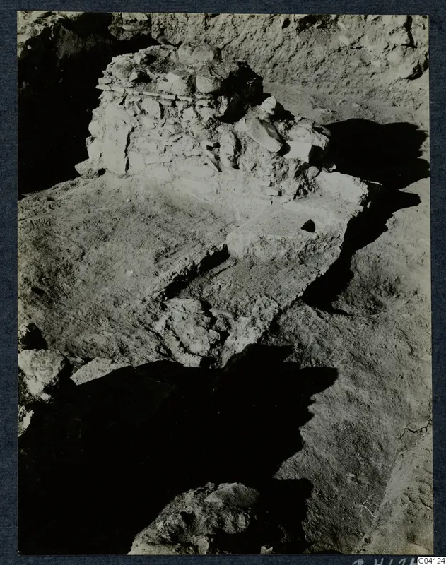 Excavated stone structure at Soli, Cholades Temples A-B, with a stepped earth surface in front of it.