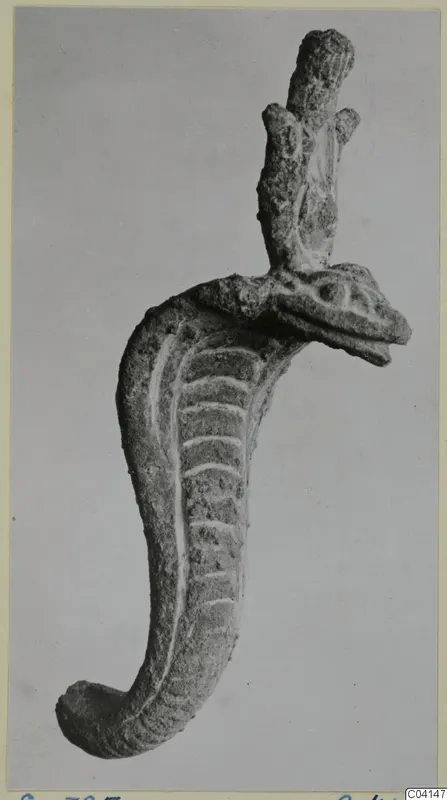 Bronze object with a snake-like head and ridged curved body, from Soli
