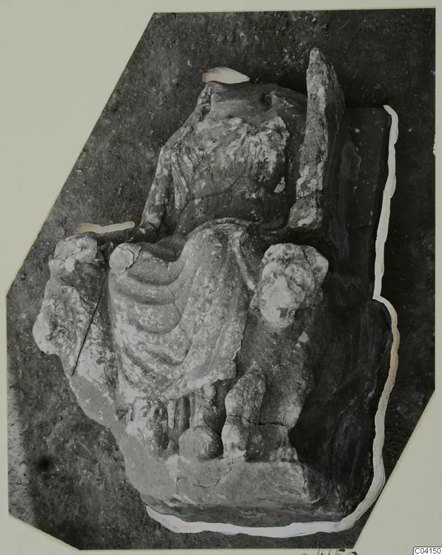 Stone sculpture of a seated figure in a draped garment, from Soli