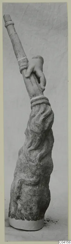 Marble sculpture from Soli: a carved hand grips a tall banded shaft above a textured, draped base.