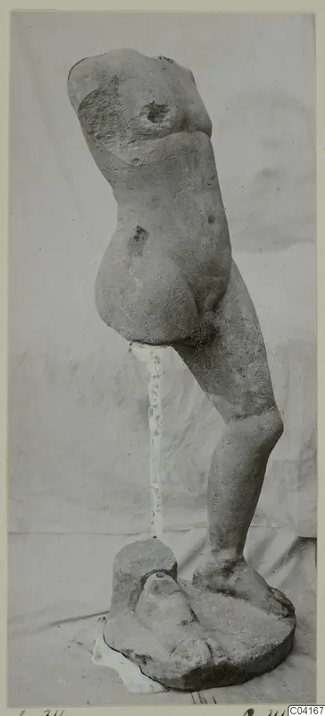 Stone statue from Soli: a nude standing torso, head and arms missing, on a rough base