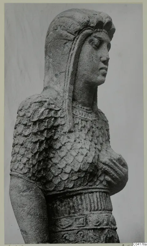Statue from Soli in stone, head and upper body of a figure with a scale-patterned garment