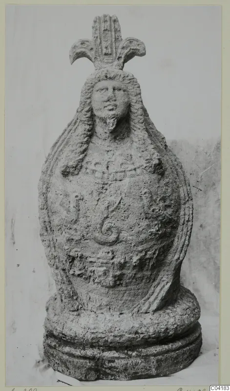 Stone statue from Soli: a bearded head with long hair and a fan-shaped crest above a rounded body
