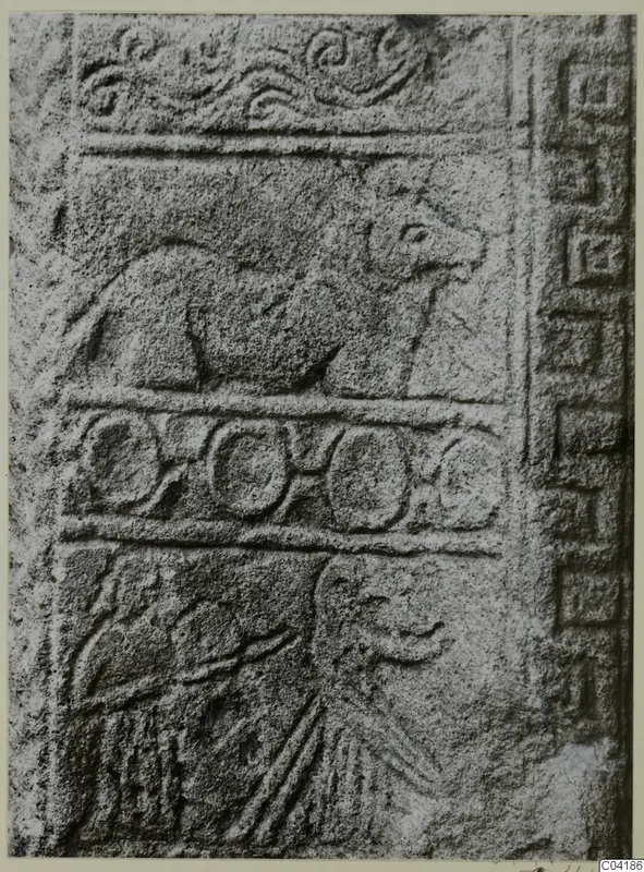 Carved stone relief slab from Soli with an animal in profile above a row of rings and a figure below