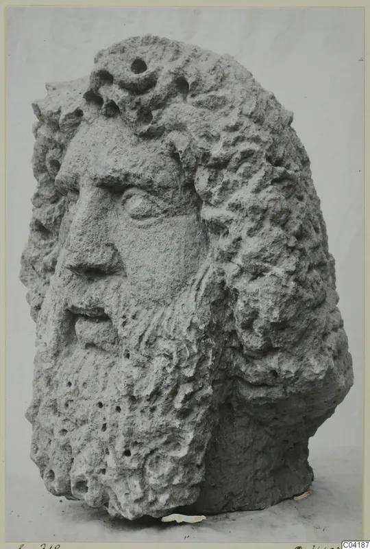 Carved stone head of a bearded man with curly hair, from Soli