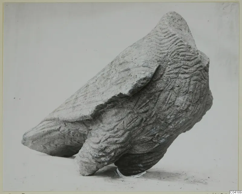Sculpture fragment from Soli in carved stone, with a pointed projection and wavy incised surface