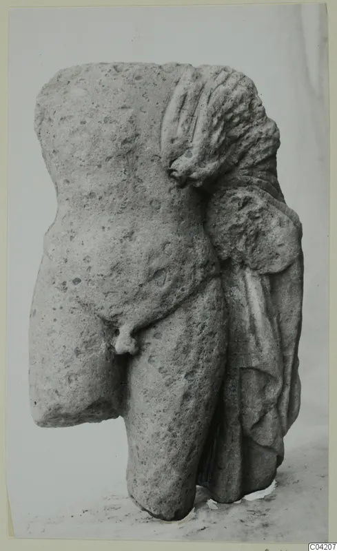 Limestone torso fragment from Mersinaki, with drapery falling over one side