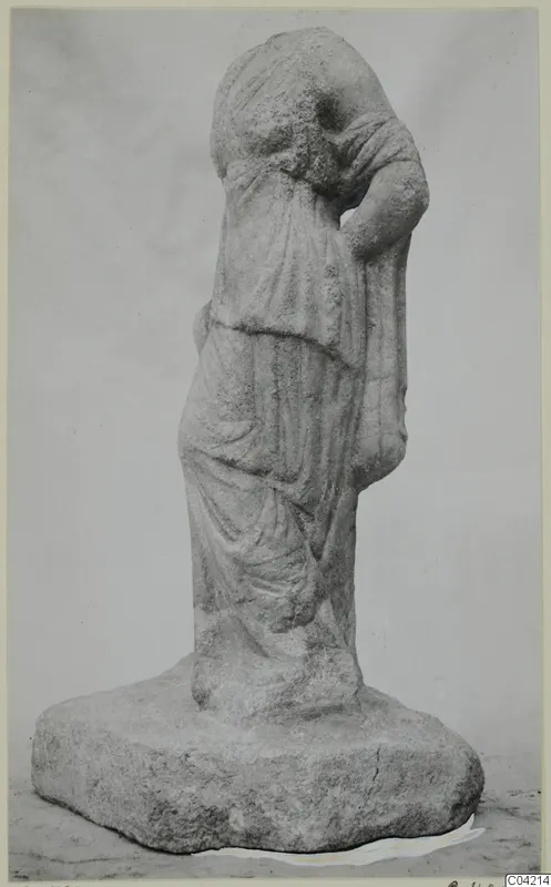 Marble statue of a draped standing figure with one arm raised to the head, on a rectangular base