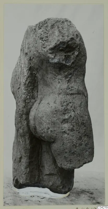 Weathered limestone sculpture from Mersinaki, an upright figure with a pitted, eroded surface