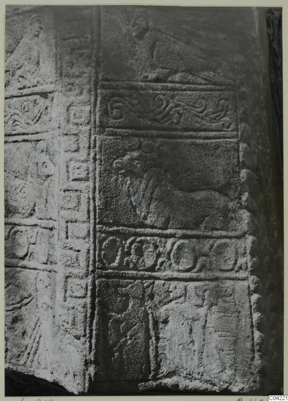 Carved stone relief from Soli showing horizontal bands of scroll, animal and figure motifs