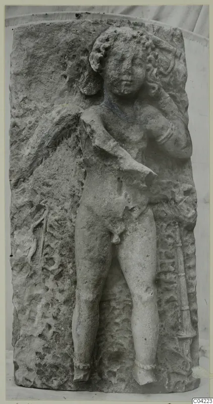 Carved stone relief of a standing nude male figure from Soli, on a weathered block