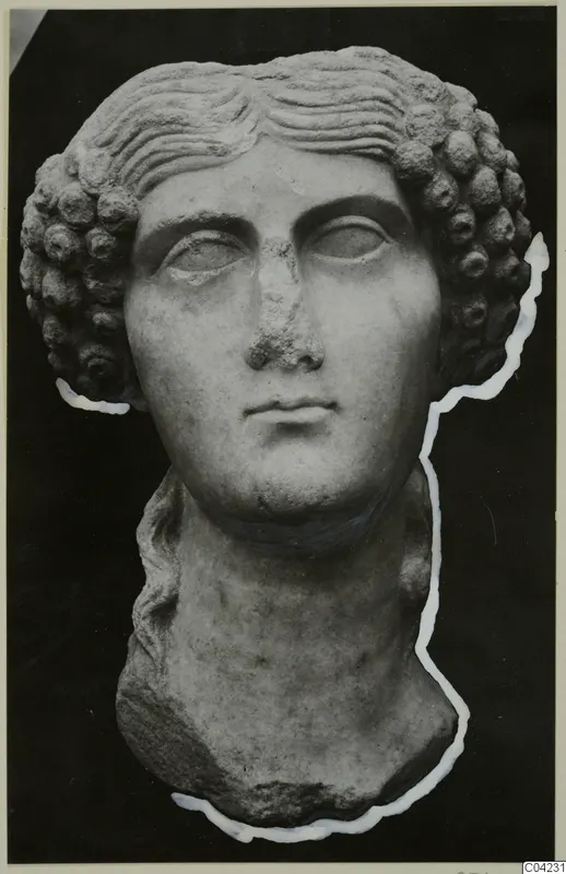 Marble sculpture of a head with curled hair and a long neck