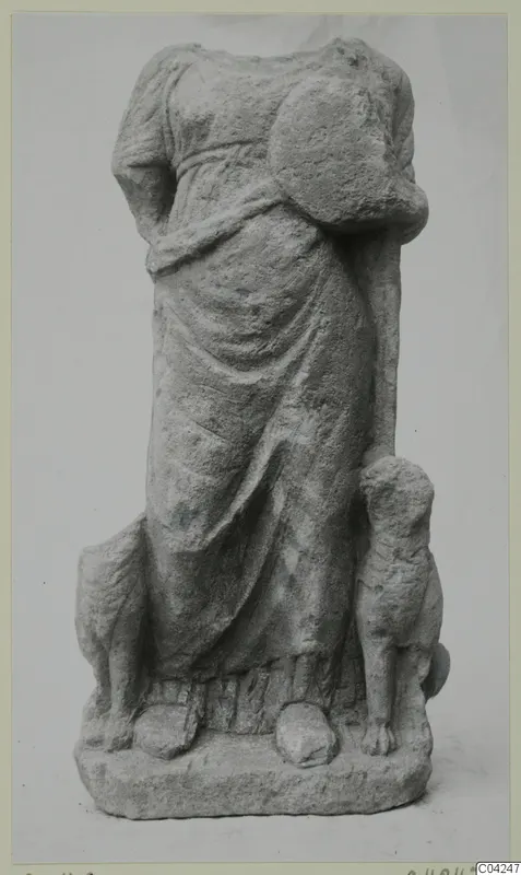 Headless stone statue of a draped standing figure with an animal on each side, from Soli