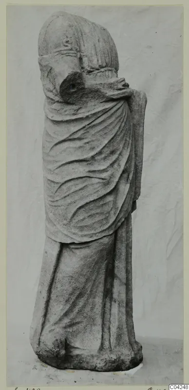 Stone statue of a standing draped figure from Soli, with the mantle pulled up over the head and body.