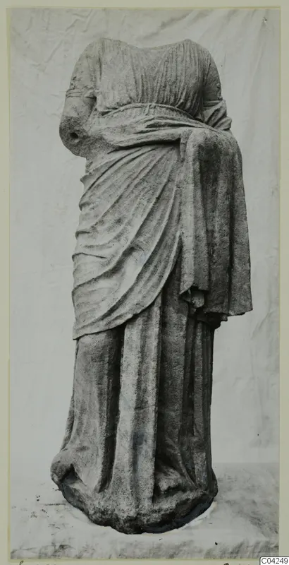 Headless draped stone statue of a standing figure, from Soli.