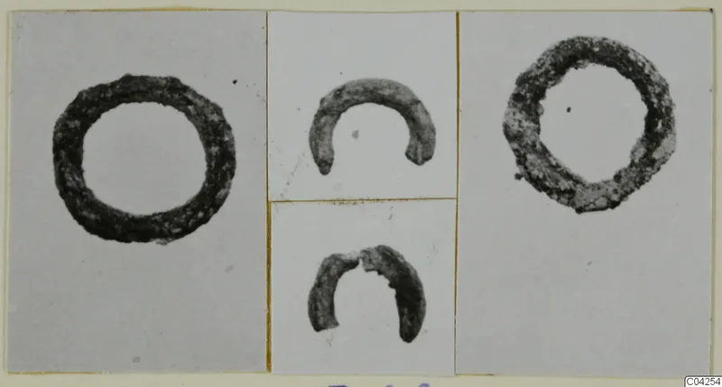 Four photographs of bronze rings and ring fragments mounted on a card, from Milia