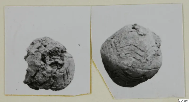 Two small rounded objects from Milia, one with incised chevron lines, shown in two prints mounted side by side