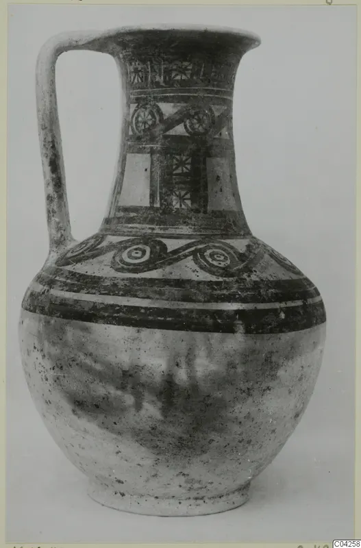 Painted jug with a strap handle and banded decoration, from Milia.