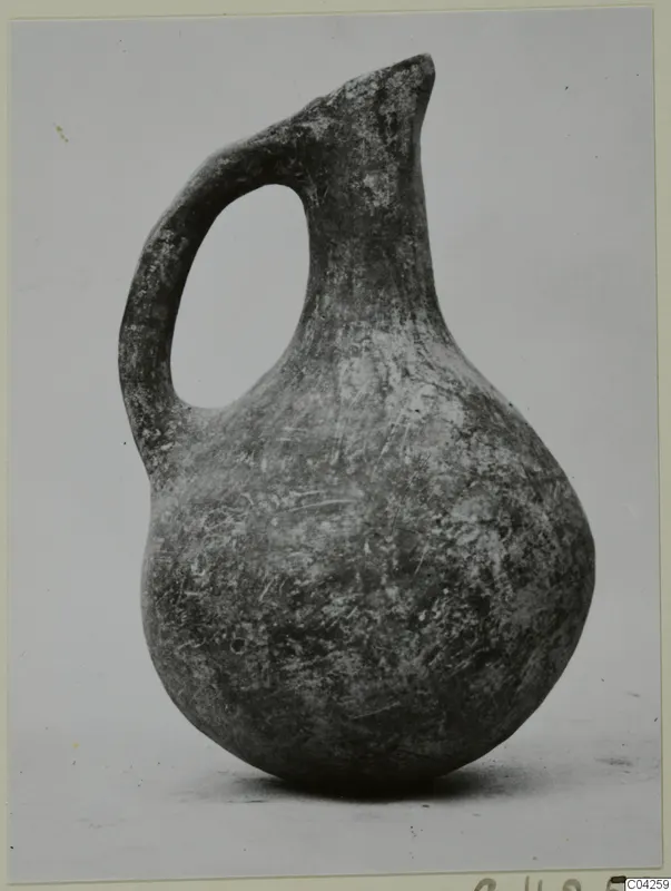 One-handled jug of Black Slip Ware with a pinched spout, from Milia