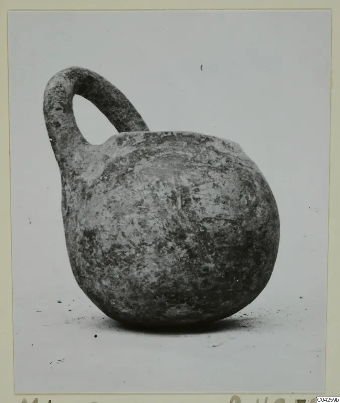 Pottery Monochrome Ware vessel with a single loop handle, from Milia