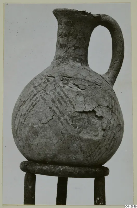 White Painted IV-V jug from Milia with a single loop handle and diagonal painted bands