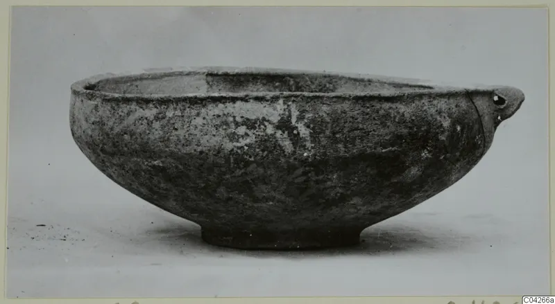 Pottery bowl with a small pierced handle, from Milia