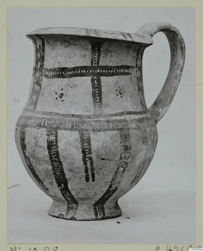 Pottery jug with a single loop handle, dark painted bands and dots on a pale slip, from Milia.