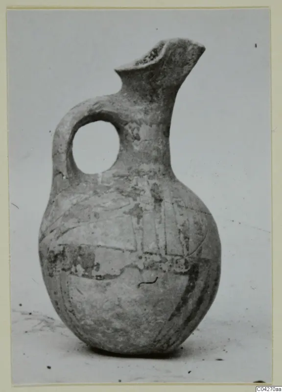 White Painted jug from Milia with a loop handle and pinched spout