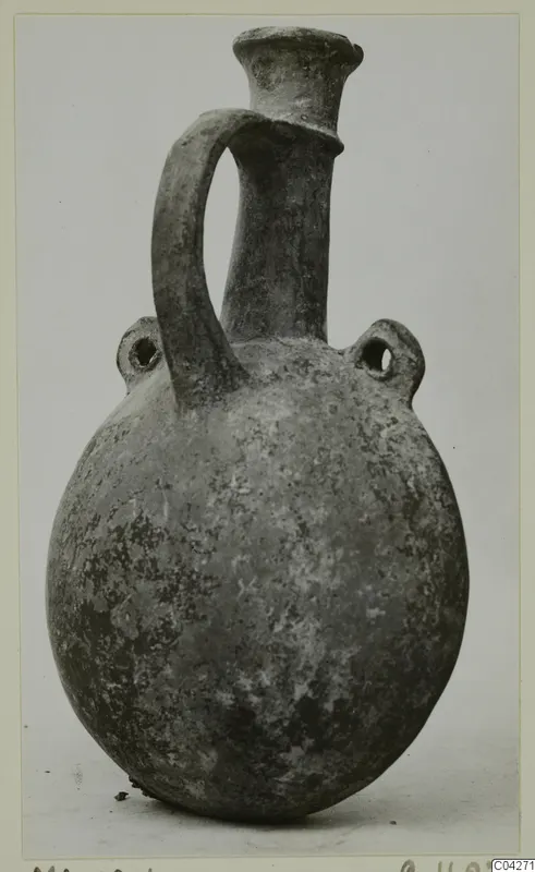 Pottery Base-Ring Ware vessel from Milia with a trumpet neck, strap handle and two pierced lugs