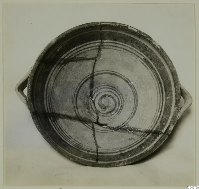 Pottery bowl-jar with two horizontal handles, from Enkomi, seen from above with concentric bands and a central spiral.